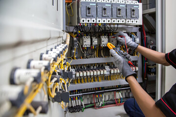 Electricity and electrical safety maintenance service system, Technician hand checking electric...