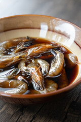 Close-up of Teochew Marinated Raw Shrimp on the table, Chinese food