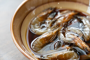 Close-up of Teochew Marinated Raw Shrimp on the table, Chinese food