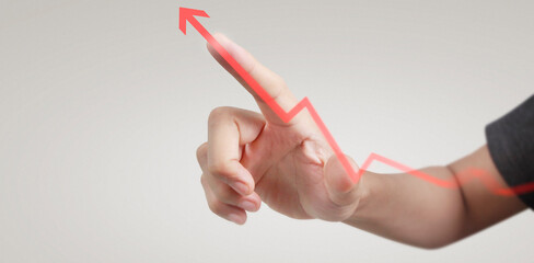 Hand touching graphs of financial indicator and accounting market economy analysis chart