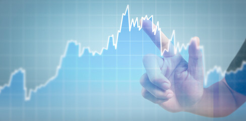 Hand touching graphs of financial indicator and accounting market economy analysis chart