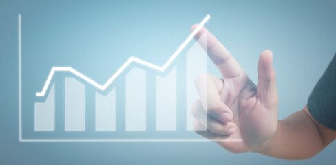 Hand touching graphs of financial indicator and accounting market economy analysis chart