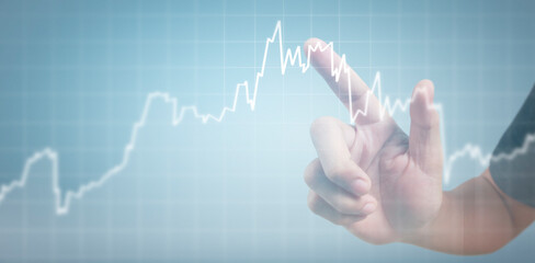 Hand touching graphs of financial indicator and accounting market economy analysis chart