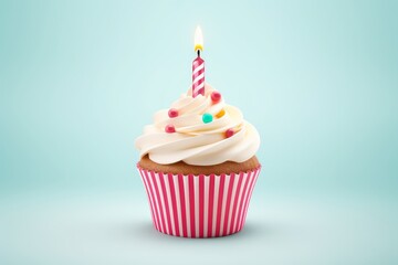 A festive cupcake with one candle on a blue background.
