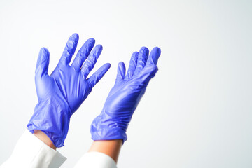 hand pointing with purple surgical medical nitrile gloves isolated