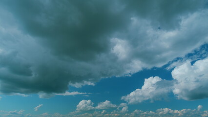 Obraz premium Cumulus Cloud Cloudscape. B Roll Blue Sky And Gray Cloud. Summer Blue Sky. White Clouds Background.