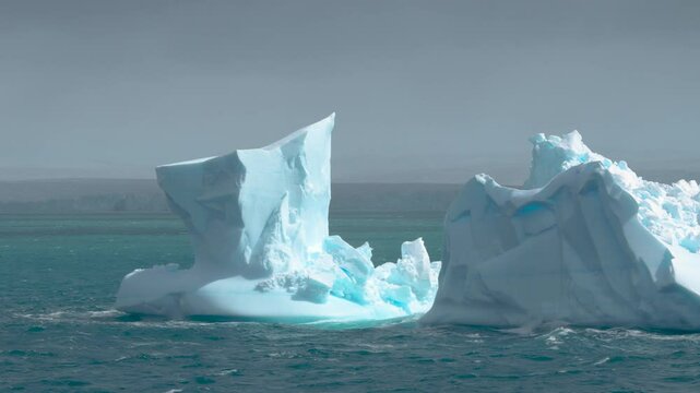 Penguins on Iceberg Close Up Antarctica Cruise Large Blue Ice Passing By
