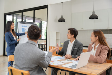 Asian Business Group Chat about graph work Present in meetings, in the office