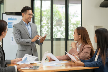Pregnant woman sitting and playing with a tablet