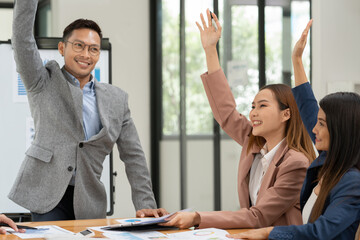 Pregnant woman sitting and playing with a tablet