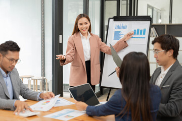 Pregnant woman sitting and playing with a tablet
