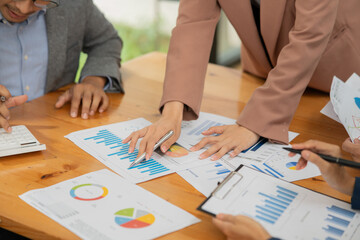 Asian businessmen, women and men Talk about new projects, presents at home office.