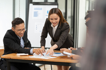 Pregnant woman sitting and playing with a tablet