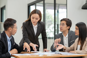 Asian Business Group Chat about graph work Present in meetings, in the office