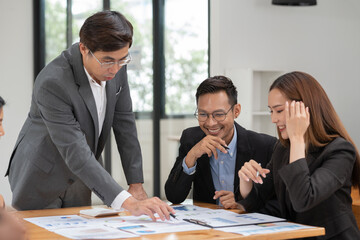 Group of business people meeting and present work on the board