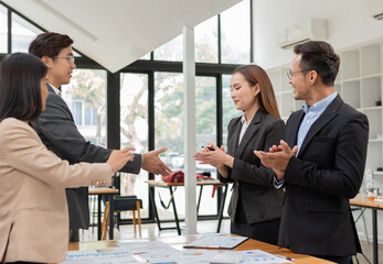 Fototapeta premium Asian Business Group Chat about graph work Present in meetings, in the office