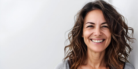 Confident Smile, Natural Beauty, Radiant young woman with a captivating smile against a neutral backdrop, Young beautiful Hispanic woman, black wavy bob hairstyle, white background, copy space