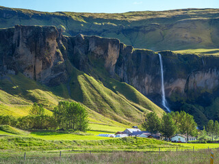 waterfall and rural community -Iceland Ring Road