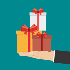 Man hand holding colorful gift boxes. Male business hand hold present box gift, christmas or birthday souvenir. Celebration, boxing day, congratulation.