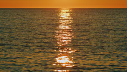 Sea With Sun Light In Background At Sunset. Orange And Red Sunset Over Sea. Fantastic Natural...