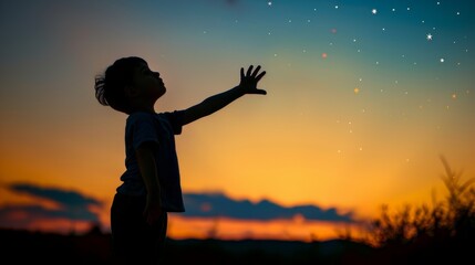 Silhouette of a little child reaching out to grab stars. Expresses the ambition. The joy of a small child with dreams. Kid having fun at sunset. Summer vacation and travel concept.