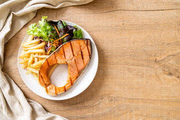 grilled salmon steak fillet with vegetable and french fries
