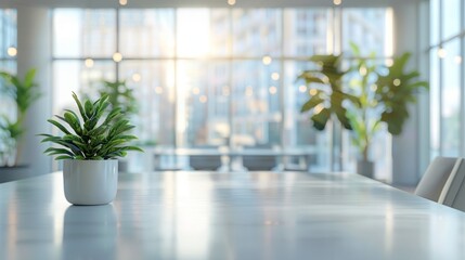 A modern office interior with a blurred background, white desk and glass wall, blurred focus on an open space or conference room table