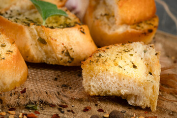 Tasty baguette with garlic and herbs 