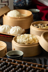 Chinese steamed pork shumai. Bamboo steamers with assorted dim sum, Chinese cuisine
