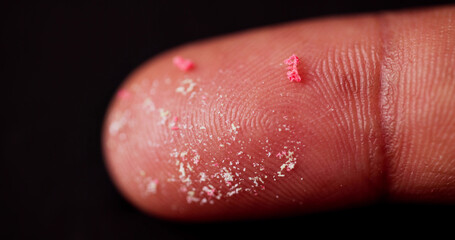 Young African American man cleaning beach