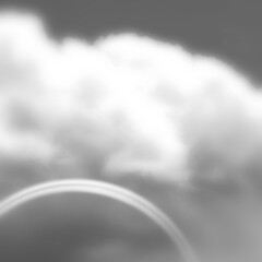 モノクロの空に虹と雲