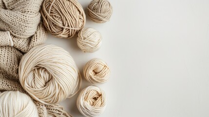 Knitting supplies with beige wool on white background ideal for craft themes