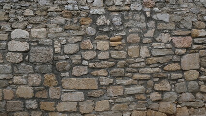 Textured wall. Rural construction area. Old form of housing