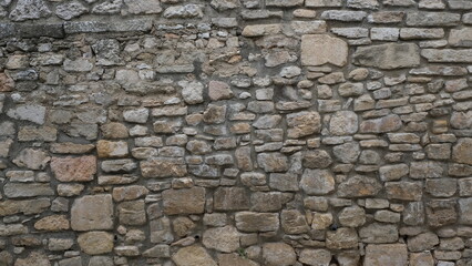 Textured wall. Rural construction area. Old form of housing