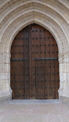 Entrance of a Gothic building with wooden door