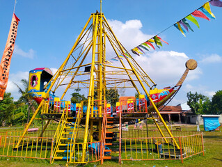 a game vehicle in the form of a pirate ship which when played swings back and forth