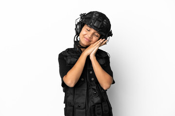 SWAT woman isolated on white background making sleep gesture in dorable expression