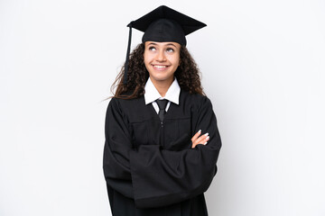 Young university graduate Arab woman isolated on white background looking up while smiling
