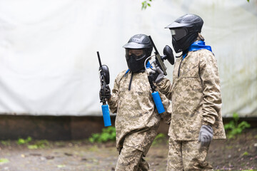 Fototapeta premium children playing paintball in the forest