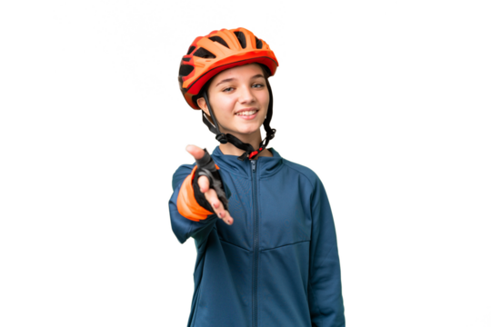 Teenager cyclist girl over isolated chroma key background shaking hands for closing a good deal