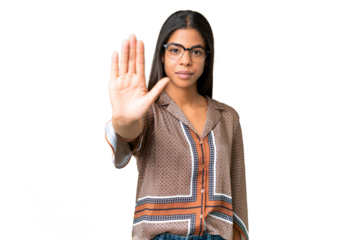 Young African American woman over isolated chroma key background making stop gesture