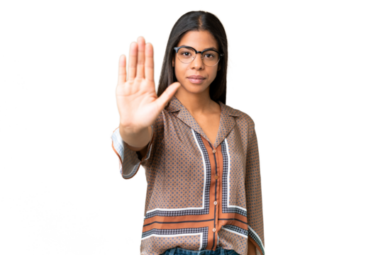 Young African American woman over isolated chroma key background making stop gesture