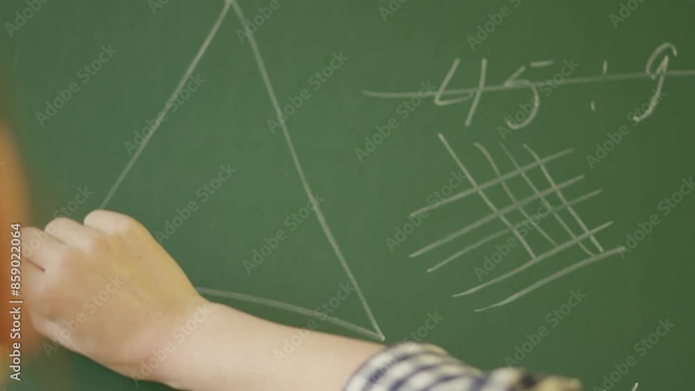 Aufkleber An educator is demonstrating mathematical formulas by writing on a chalkboard in a classroom setting, emphasizing the importance of education and learning in academic institutions