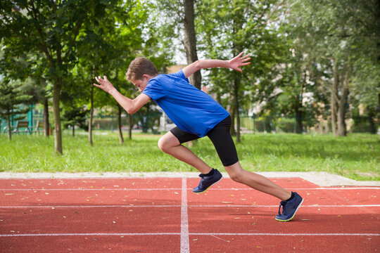 The teenager starts at the stadium.

