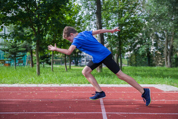 Obraz premium The teenager starts at the stadium. 