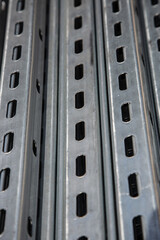 Pile steel channel for construction of a house to an outdoor site. Steel beams for the roof.