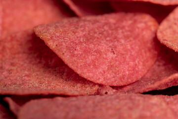 adding red dye to potato chips