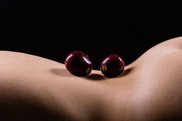 Close up of woman back with laying onion, low key