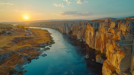A beautiful view of the sun setting over a river.