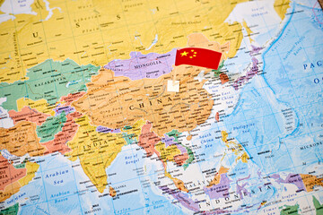 China on world map with flag